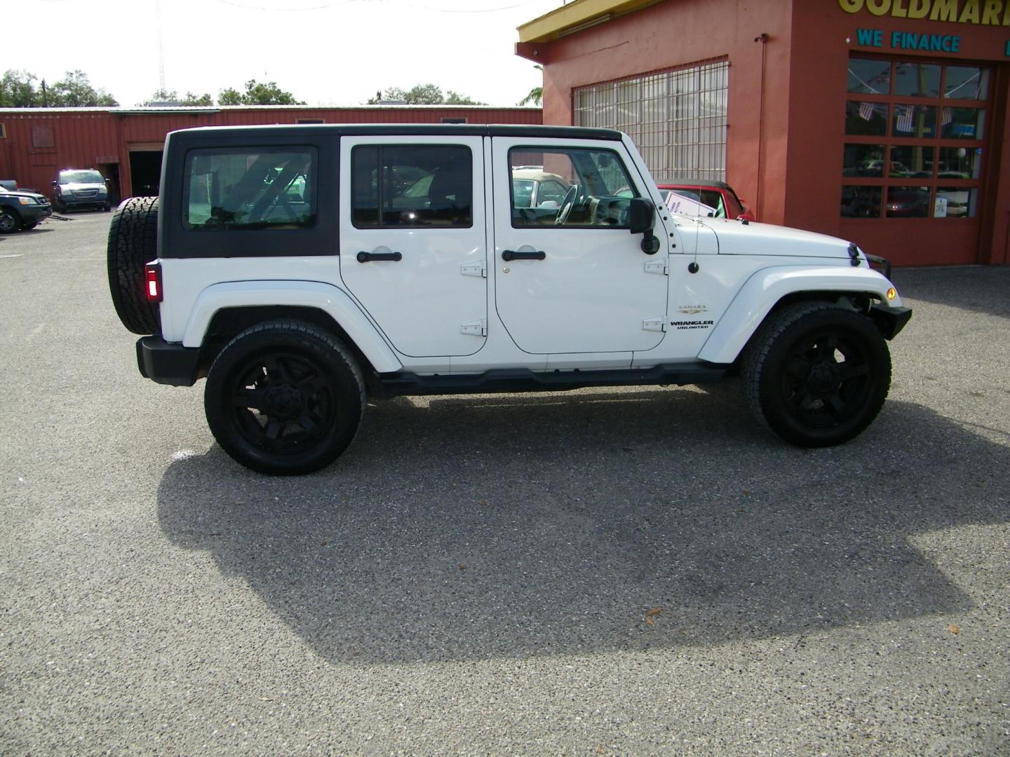 2015 White /Black Jeep Wrangler Unlimited Sahara 4WD (1C4BJWEGXFL) with an 3.6L V6 DOHC 24V FFV engine, Automatic transmission, located at 4000 Bee Ridge Road, Sarasota, FL, 34233, (941) 926-0300, 27.298664, -82.489151 - Photo#6